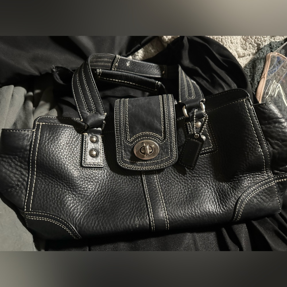 Black Coach bag with burgundy lining